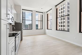 A spacious kitchen with a view of the city. at LiveWell Apartments, Pittsburgh, Pennsylvania